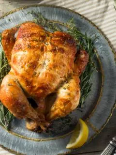 featured image showing a finished and cooked rotisserie chicken.