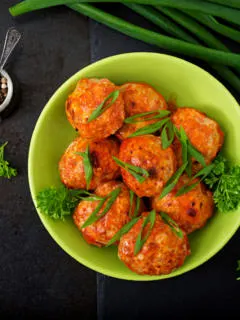 Featured image showing a bowl full of meatballs to represent recipes using ground chicken.