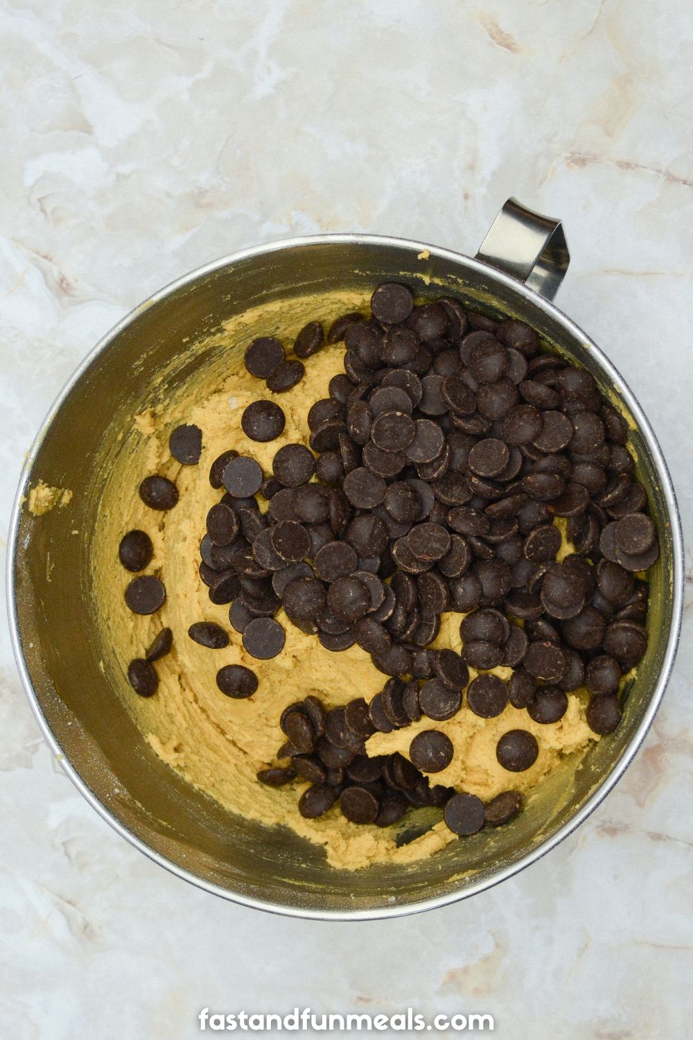chocolate chips in a mixing bowl with cookie batter